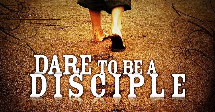 Person praying in front of a lake